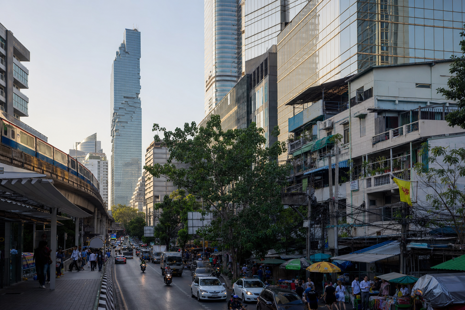 Sathorn towers, rail transit, older residential buildings, traffic, and street life