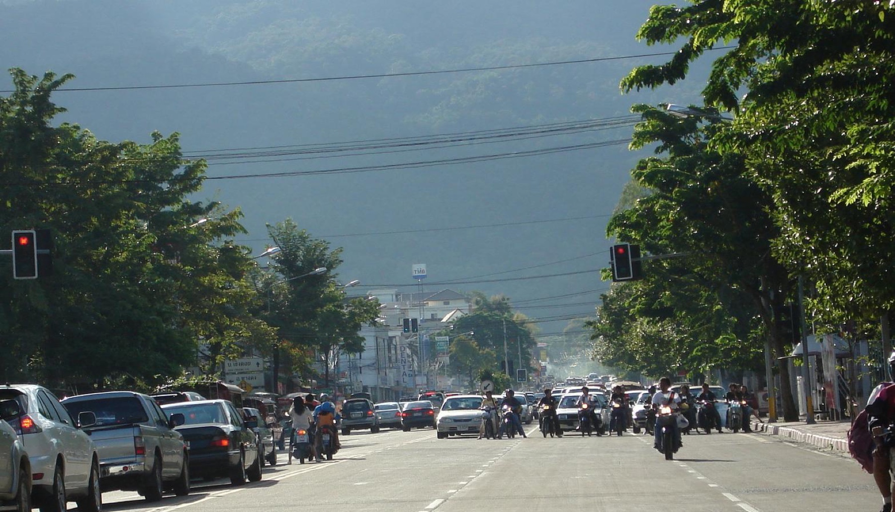 Cars and motorcycles sharing Suthep Road in Chiang Mai